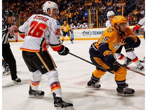 Michael Stone of the Calgary Flames plays against Kevin Fiala of the Nashville Predators at Bridgestone Arena on Tuesday, Feb. 21, 2017, in Nashville. (Frederick Breedon/Getty Images)