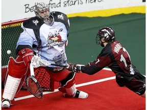 Calgary Roughnecks goalie Frank Scigliano tries to stop a shot from Colorado Mammoth Chris Wardle at the Scotiabank Saddledome in Calgary, Alta. on Saturday January 28, 2017.