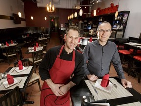 Co-owner Claudio Tarano (L) and chef Viktor Domahidy pose for a photo at Las Canarias in Calgary.