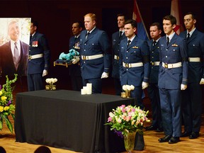Members of the 408 Tactical Helicopter Squadron carry in the ashes of Jeffrey Bird. Not a dry eye and not an empty seat for the memorial of Captain (Ret'd) Jeffrey Michael Bird as many came to pay their respects for the husband and father of two, killed in a plane crash near Cochrane. The Memorial took place at Bella Concert Hall on Mount Royal University campus in Calgary, Alta., on February 19, 2017. Ryan McLeod/Postmedia Network