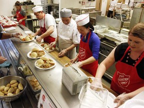 A hot meal with family, or friends, or both at the annual Family Day Dinner presented by the Salvation Army's Centre of Hope in Calgary, Alta., on February 20, 2017. Hundreds packed the house and shared food, conversation, made new friends and reacquainted themselves with old friends. Ryan McLeod/Postmedia Network