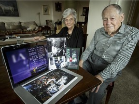 John and Constance Martin, grandparents of film director Damien Chazelle, sit with family photos featuring Chazelle, in their home in Calgary.