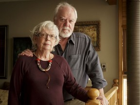 Dr. Carl Hannigan and his wife Sandra Hannigan stand for a photo inside their home in Calgary, Alta., on Tuesday, Feb. 21, 2017. The pair were recently finger-printed by U.S. border officials while returning from a vacation in Mexico. Lyle Aspinall/Postmedia Network
