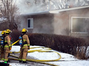 Emergency workers shut down Elbow Drive near 71st Avenue in Calgary after a house fire on Feb. 22, 2017. No one was injured in the fire.
