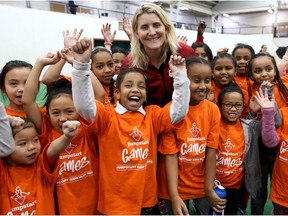 Hayley Wickenheiser, four-time Olympic gold medallist, poses with girls during Jumpstart Games for Girls at the Calgary Soccer Centre in Calgary, Alta., on Tuesday February 7, 2017. Leah Hennel/Postmedia