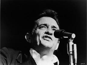 Johnny Cash singing on stage in a still from the film, 'Johnny Cash - The Man, His World, His Music,' directed by Robert Elfstrom, 1969.