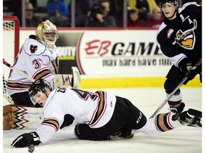 Michael Zipp leaps in front to swat away a puck against the Vancouver Giants earlier this season. (Ryan McLeod)