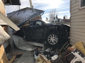 A Jeep Cherokee lies amidst the wreckage of two Olds homes after it crashed on Friday, Feb. 03, 2017. Photo courtesy Doug Wagstaff