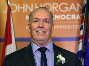 B.C. NDP leader John Horgan speaks to media following the speech from the throne at her office at the Legislature Building Tuesday, February 14, 2017 in Victoria, B.C.