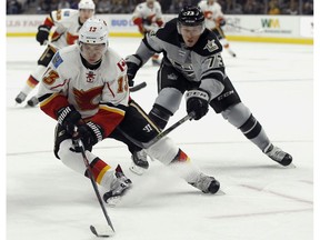 Calgary Flames left wing Johnny Gaudreau controls the puck against Los Angeles Kings centre Tyler Toffoli in Los Angeles Nov. 5, 2016. The Kings won 5-0. (AP Photo)