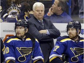 St. Louis Blues head coach Ken Hitchcock watches during the second period in Game 2 of the NHL hockey Stanley Cup Western Conference finals against the San Jose Sharks in St. Louis. The Blues have fired Hitchcock. Assistant and coach-in-waiting Mike Yeo replaced him. General manager Doug Armstrong announced the change Wednesday, Feb. 1, 2017.