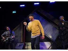 Khari Wendell McClelland, centre, Tanika Charles, right, and guitarist Noah Walker performer the documentary theatre piece called Freedom Singer during rehearsal in Toronto.