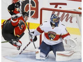 Lance Bouma of the Calgary Flames soars past Florida Panthers goalie Roberto Luongo in Calgary on Tuesday, Jan. 17, 2017. (Lyle Aspinall)