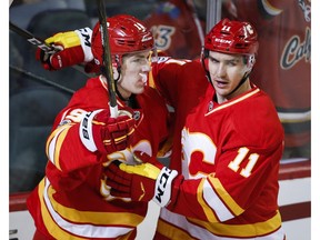 Calgary Flames left wing Matthew Tkachuk, left, celebrates his goal against the Philadelphia Flyers with teammate Mikael Backlund in Calgary on Wednesday, Feb. 15, 2017. (Jeff McIntosh/The Canadian Press)