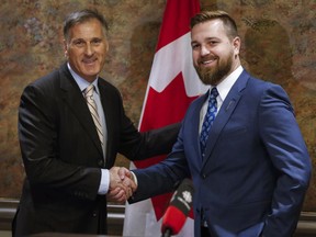 Maxime Bernier, left, leadership candidate for the Conservative Party of Canada, announces that he has received the endorsement of Alberta Wildrose MLA Derek Fildebrandt (right) in Calgary, Alta., Monday, Feb. 27, 2017.THE CANADIAN PRESS/Jeff McIntosh ORG XMIT: JMC103