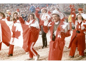 Candle-carrying Canadian athletes enter McMahon Stadium to wild applause before the Olympic Winter Games close on Feb. 29, 1988.