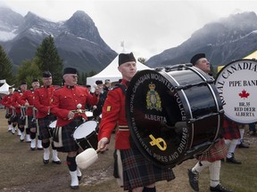 The Royal Canadian Mounted Police Regimental Pipes and Drums and the Red Deer Royal Canadian Legion march at the Canmore Highland Games.