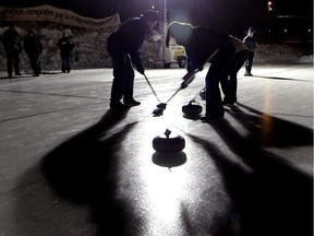 Curlers participate in the Ironman Outdoor Curling Bonspiel in Winnipeg.