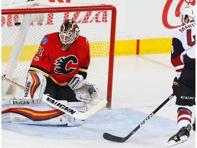 Arizona Coyotes Jordan Martinook scores on Calgary Flames goalie Chad Johnson during NHL hockey in Calgary, Alta., on Monday, February 13, 2017.