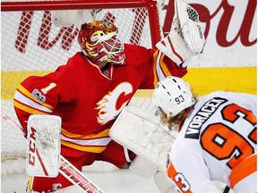 Calgary Flames Brian Elliott makes a save on a shot by Jakub Voracek of the Philadelphia Flyers during NHL hockey in Calgary, Alta., on Wednesday, February 15, 2017.