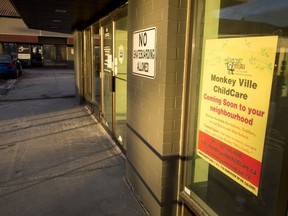 Signs announce the coming of Monkey Ville ChildCare at Ranchlands Plaza in Calgary, on Tuesday, Feb. 14, 2017. The owner and patrons of Stavros Pizza Sports Bar two doors down are concerned about a daycare being part of the facility. Lyle Aspinall/Postmedia Network