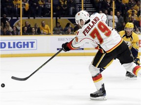 Calgary Flames left wing Micheal Ferland (79) shoots and scores a goal against the Nashville Predators during the first period of an NHL hockey game Tuesday, Feb. 21, 2017, in Nashville, Tenn. Defending for the Predators at right is Roman Josi.