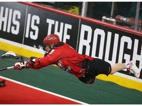 Roughnecks Curtis Dickson flies through the air as he shoots on net during National Lacross League game action between the Vancouver Stealth and the Calgary Roughnecks at the Scotiabank Saddledome in Calgary, Alta. on Friday January 6, 2017.