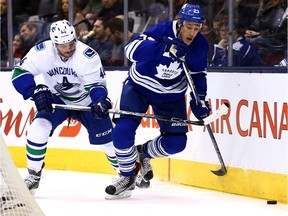 SShawn Matthias of the Toronto Maple Leafs gets past Matt Bartkowski of the Vancouver Canucks during NHL action at the Air Canada Centre in Toronto on Saturday November 14, 2015. Bartkowski signed with the Flames and could make his debut Saturday at the Vancouver Canucks.