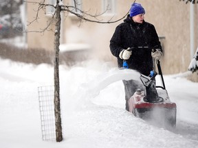 A snowblower lets snow fly during a very blustery day in Kensington on February 6.