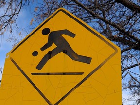 A playground zone sign in Renfrew in NE Calgary, Alta. on Tuesday November 11, 2014. Police are looking into using speed camera's in playground zones in the city. Stuart Dryden/Calgary Sun/QMI Agency