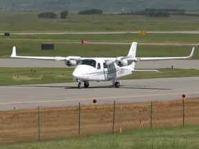 A Tecnam twin-engine plane lands at Springbank Airport.