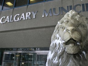 The lion in front of city hall is spattered with snow as the city announces its tax assessments for 2014 in Calgary, Alta., on Friday January 3, 2014. Mike Drew/Calgary Sun/QMI Agency