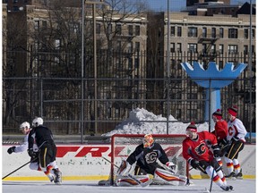 The Calgary Flames practice on a ice rink in New York's Central Park Saturday, Feb. 4, 2017. The Flames are set to play the New York Rangers on Sunday.