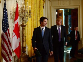 Prime Minister Justin Trudeau and U.S. President Donald Trump arrive to take part in a joint press conference at the White House in Washington, D.C. on Monday, Feb. 13, 2017. THE CANADIAN PRESS/Sean Kilpatrick ORG XMIT: SKP132