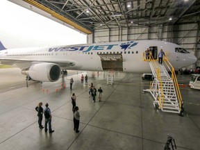 A new Boeing 767-300 is unveiled at the WestJet hangar in Calgary, on Aug. 27, 2015.