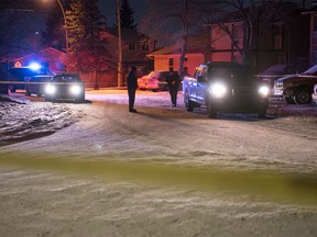 Calgary police crime scene investigators collect forensic evidence at the scene of a serious stabbing in the 700 blk. of Whitehill Way N.E. in Calgary, Alta., on Monday, Feb. 27, 2017.