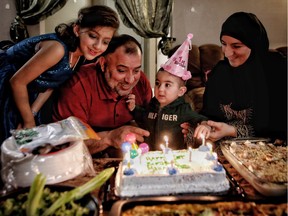 Yahya Al Masalma and his wife Seham Talab celebrate their son Mohammad's first birthday at their home in Calgary with family including youngest daughter Najat Al Masalmeh,8. Mohammad was the first baby born in Calgary to recent Syrian refugee parents. in Calgary, Ab., on Thursday February 2, 2017. Leah Hennel/Postmedia