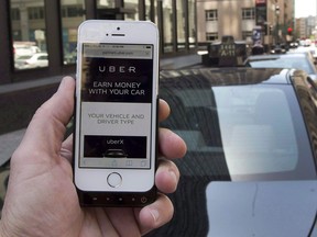 The ride-sharing app Uber is shown on a smartphone in Montreal on May 14, 2015. More Canadians are hiring Uber taxis and renting space through Airbnb, but the lack of extensive study has made the meteoric rise of the so-called sharing economy practically fall off the radar of politicians. THE CANADIAN PRESS/Ryan Remiorz  0107 biz ko uber  ORG XMIT: POS2015090806273111