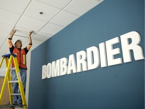 A worker repairs the ceiling in the main entrance of a Bombardier Aerospace plant in Queretaro, March 2, 2008.