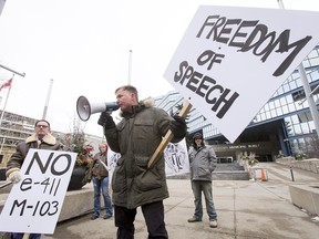 Event organizer Stephen Garvey speaks during his anti-Motion 103 rally outside of City Hall in Calgary, Alta., on Saturday, March 4, 2017. Two opposing demonstrations were occurring simultaneously just metres from each other, one supporting Motion 103, which would deem Islamophobia a hate crime, and the other opposing it, saying it would hurt freedom of speech. Lyle Aspinall/Postmedia Network