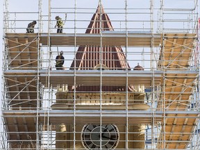 Crews work on the sandstone exterior of Old City Hall on Feb. 13, 2017.