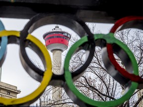 The Calgary Tower is seen with Olympic rings built into railing at Olympic Plaza in downtown Calgary, Alta., on Monday, March 20, 2017. The city is considering another Winter Olympics bid.