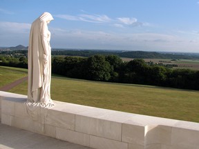 The sculpture of a grieving Young Canada, looking out over the Douai plain at the Vimy Memorial on Friday September 16, 2016 in Vimy, France.