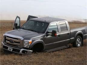 A pick up truck is shown in a ditch on northbound highway 2 near Didsbury, Alta, about 75 km north of Calgary, Alta on Friday March 31, 2017 after Calgary Police and RCMP followed the vehicle at high speeds in heavy traffic and the truck missing one front wheel. One man is in custody after he ditched the vehicle and started walking on highway 2. Jim Wells//Postmedia