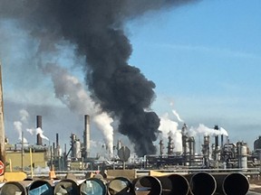 A plume of smoke hangs over the Syncrude Canada Ltd. Mildred Lake Upgrader near Fort McMurray on Tuesday, March 14, 2017. A fire broke out just before 2 p.m and one person was taken to hospital in serious but stable condition. Photo  Supplied