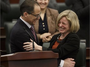 Finance Minister Joe Ceci and Premier Rachel Notley celebrate as he tables the budget March 16.