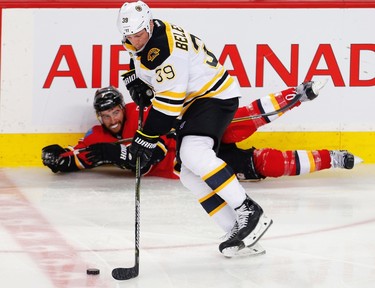 Boston Bruins Matt Beleskey blows by T.J. Brodie and ends up scoring on Chad Johnson of the Calgary Flames during NHL hockey in Calgary, Alta., on Wednesday, March 15, 2017. AL CHAREST/POSTMEDIA