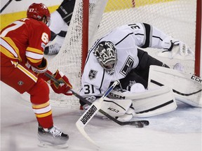 Los Angeles Kings goalie Ben Bishop stops Calgary Flames' Michael Frolik in Calgary on Sunday, March 19, 2017. (The Canadian Press)