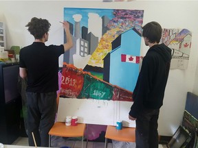 Braden Stewart, left,  and Rory Sandl paint their mural at the Alex in Calgary. This mural is part of 150+ Reasons We Love Canada, a national project working to create 60 original murals.