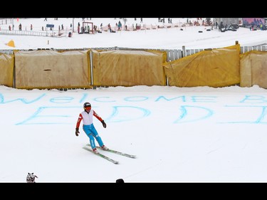 Eddie the Eagle skis past a welcome back Eddie sign in the snow at Canada Olympic Park on Saturday March 5, 2017. The 1988 Olympic sensation was back in Calgary to help support local jumpers. About a 1000 fans watched Eddie jump.